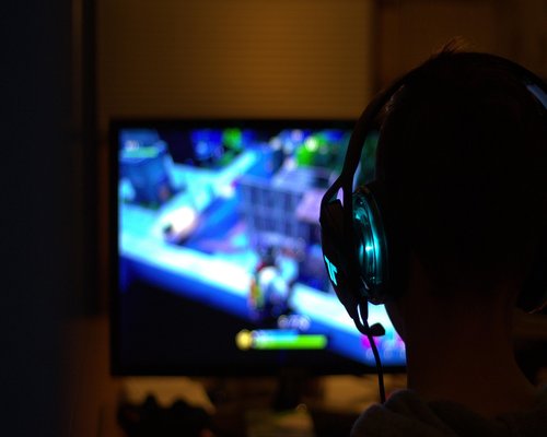 Controllers headsets gaming chairs and collectibles on display